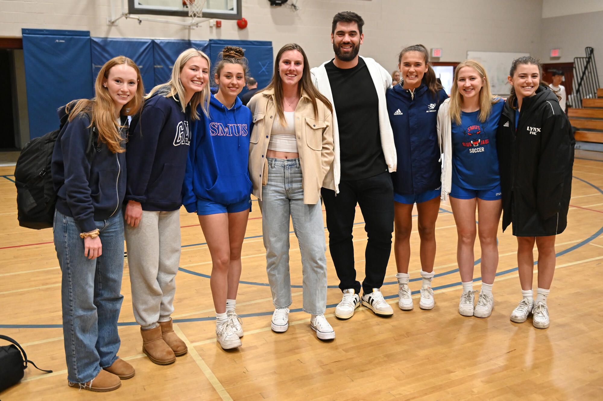 Laurent Duvernay-Tardif poses with a group of SMUS students