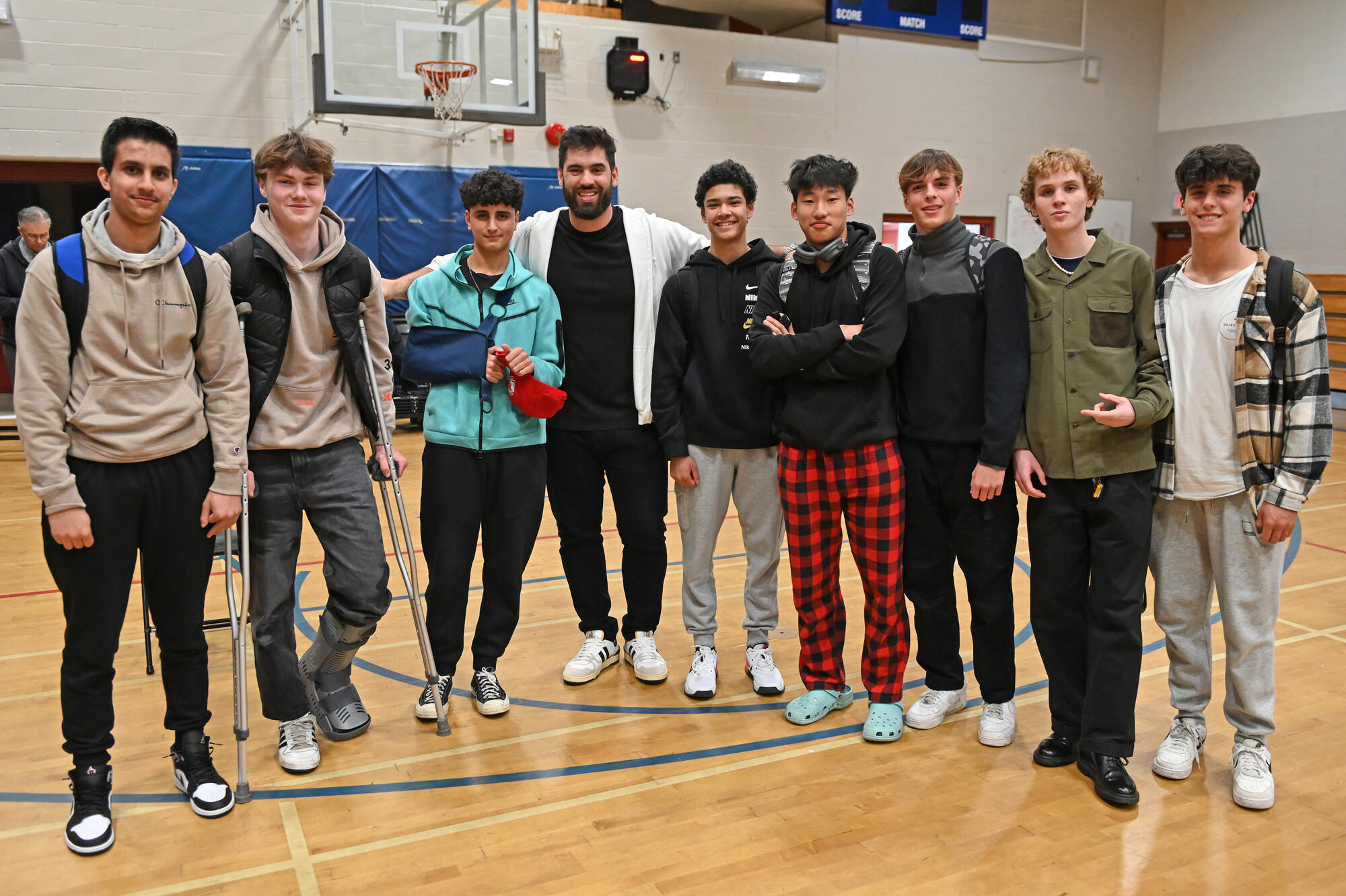 Laurent Duvernay-Tardif poses with a group of SMUS students