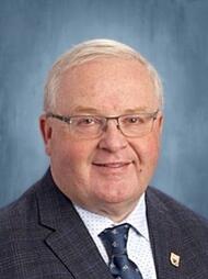 A portrait of Richard DeMerchant