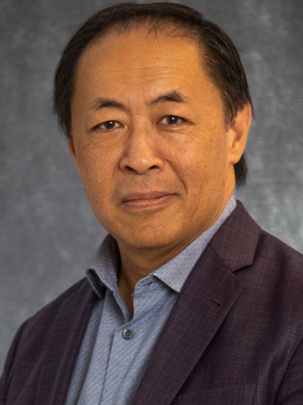 A portrait of Kyman Chan '85