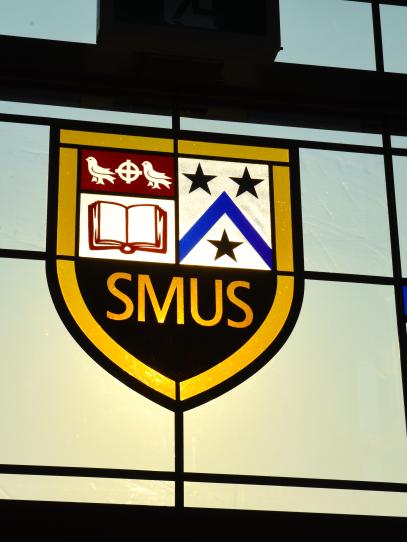 SMUS crest in stained glass