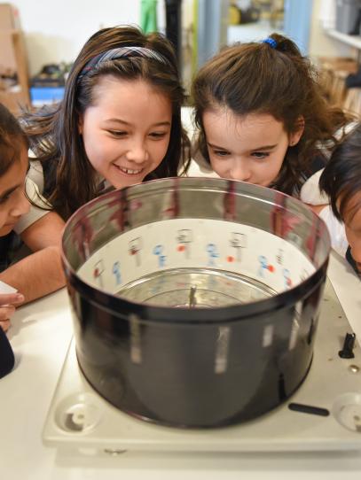Junior School students observing  a zoetrope in the Imagination Lab