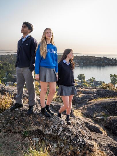 Three students look out over the water