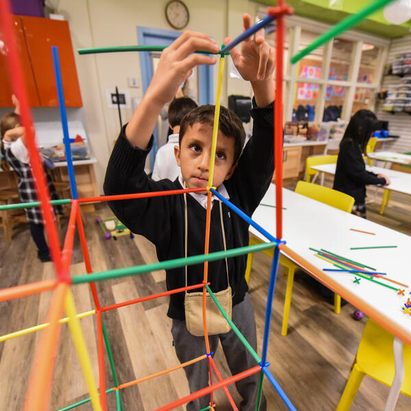 Junior School student erecting a structure in the Imagination Lab