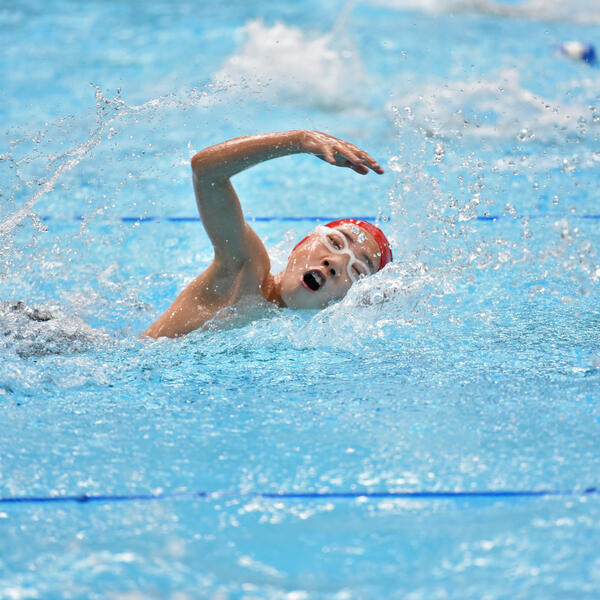 Middle School student participating in a swim jamboree