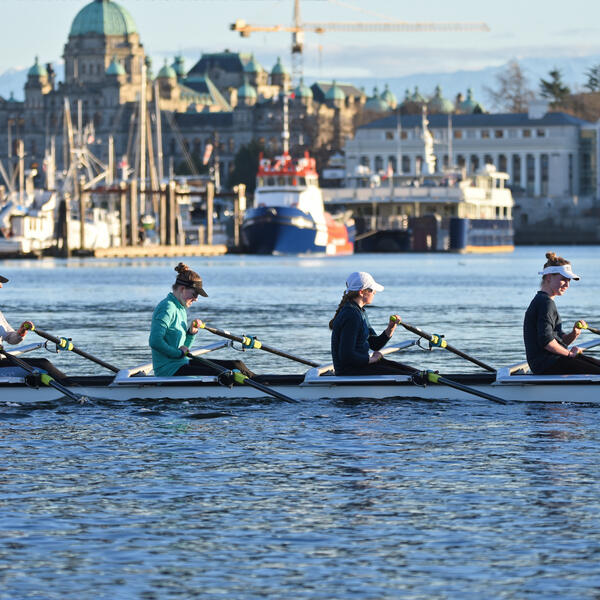 Senior School 4 person rowing shell in the Inner Harbour