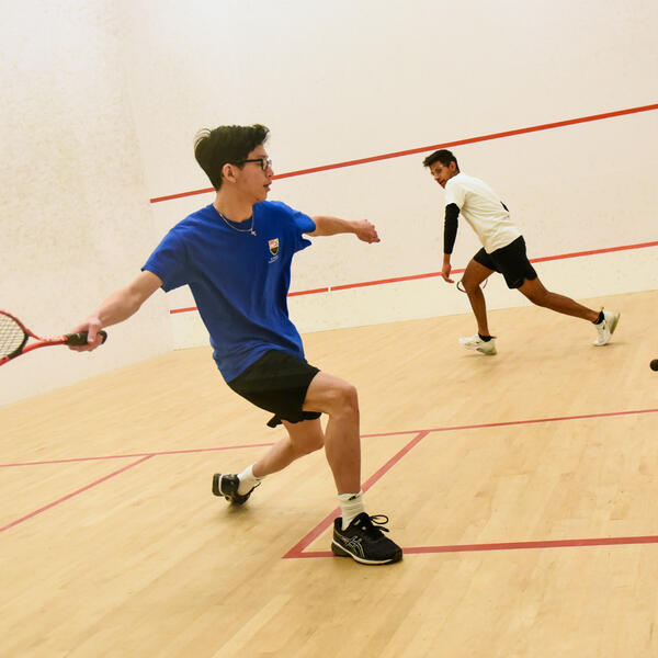 A squash game in the SMUS squash court