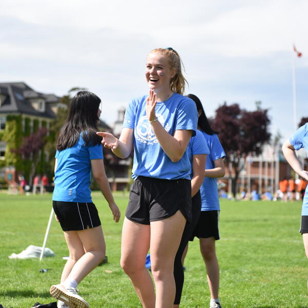 Happy students playing house games in the field