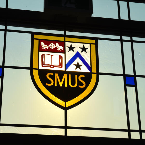 SMUS crest in stained glass