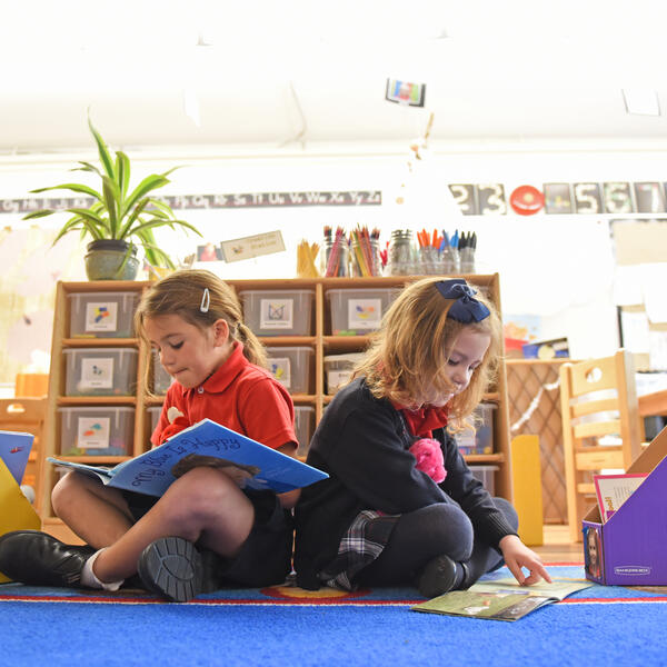 Two Kindergarten students reading