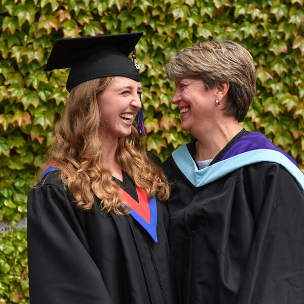 SMUS graduate and teacher share a happy moment