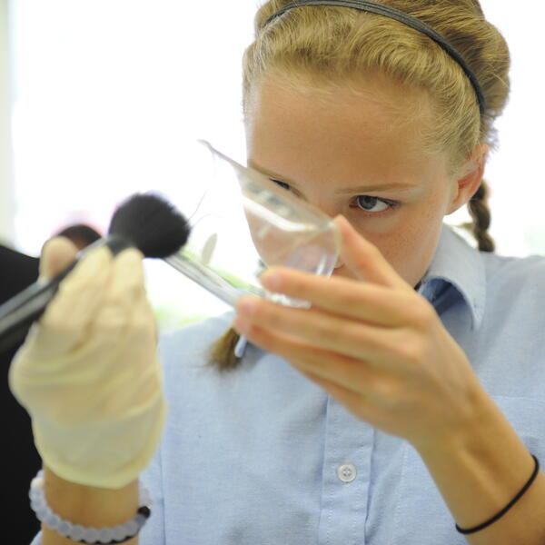 Senior School student conducting a science experiment in the lab