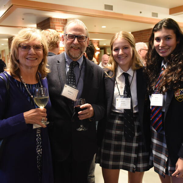 Group of students and alumni at event