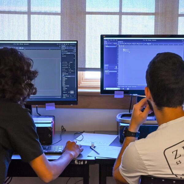 Two Game Development Campers working on their projects in Godot engine