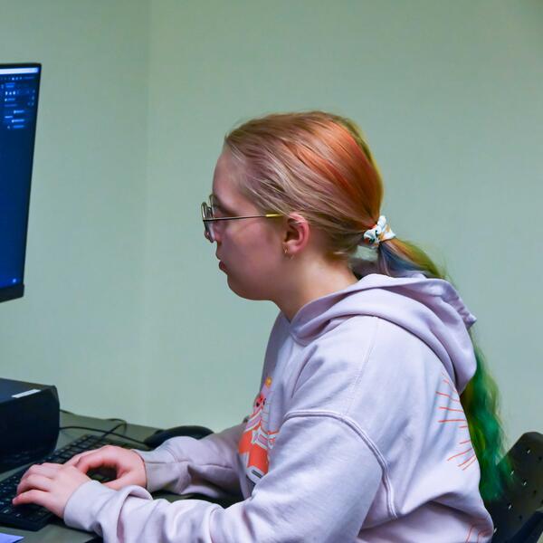 Game Development Camper working on her project