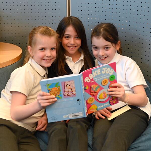 Grade 5 students reading in the library