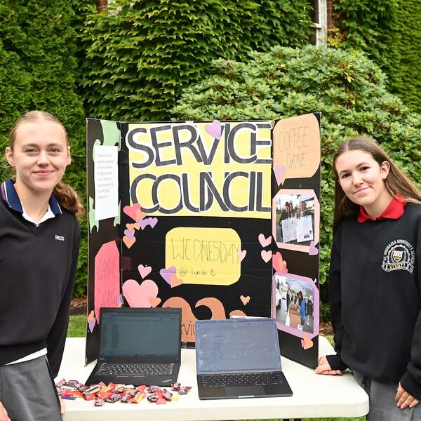 Service Council heads Lucy Turnbull and Bianca Batoni pose with their service council sign and table