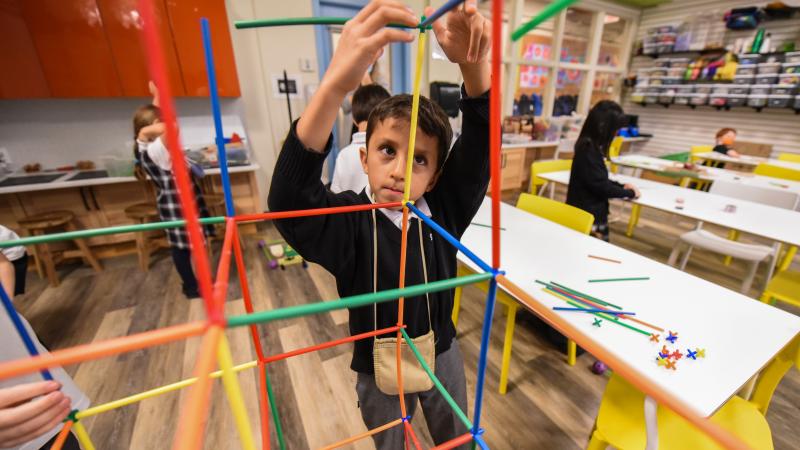 Junior School student erecting a structure in the Imagination Lab