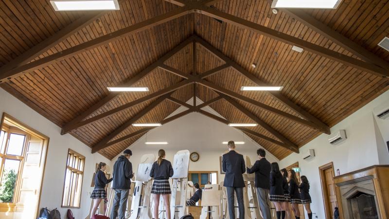 Senior School art class working on easels in Brown Hall