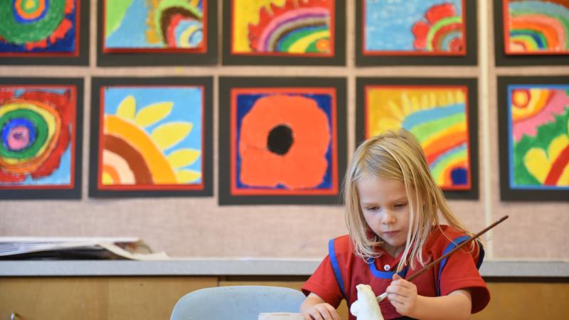 Kindergartener working on an art project