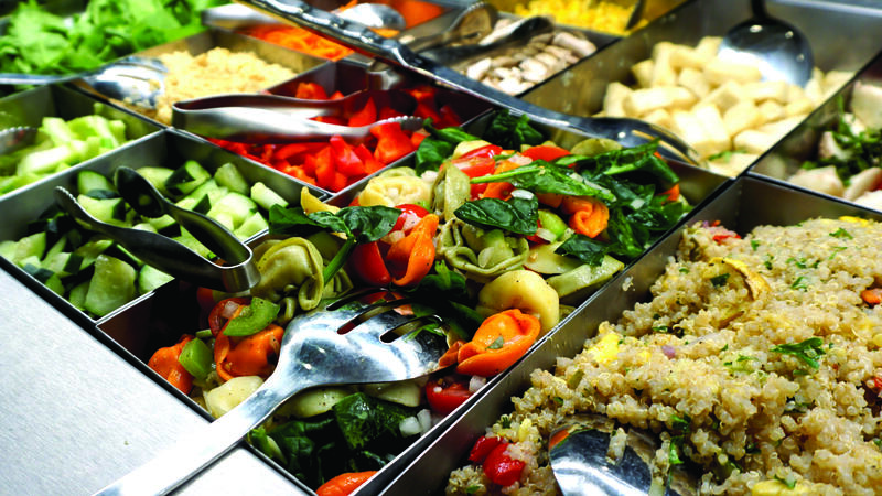 A colourful display of food in a serve-yourself style buffet