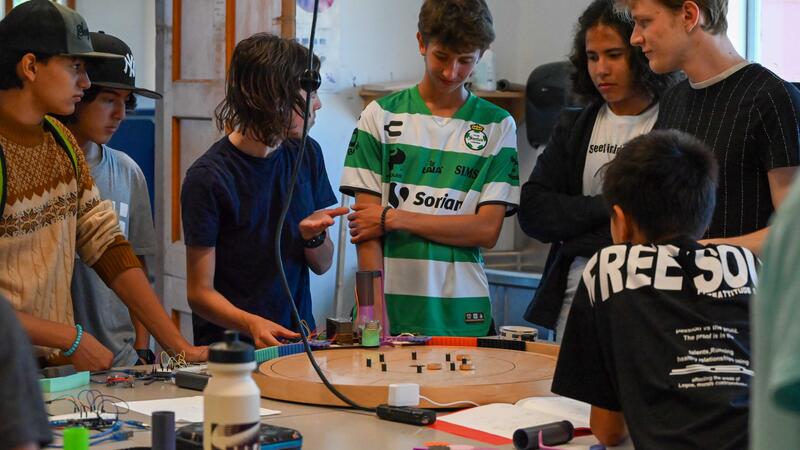 Engineering Camper showing other camps the project they have been working on for two weeks