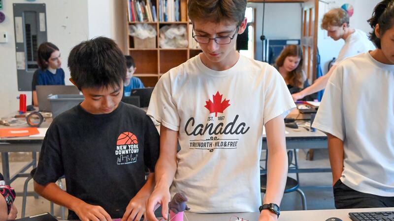 Two Engineering Campers working on a modeling project