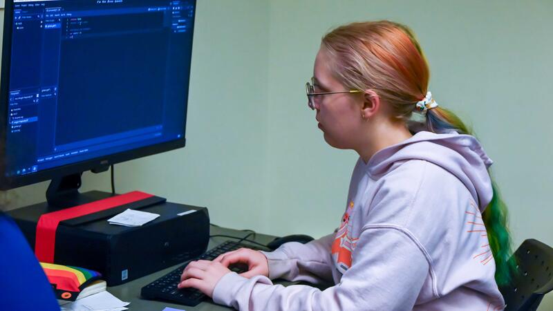 Game Development Camper working on her project