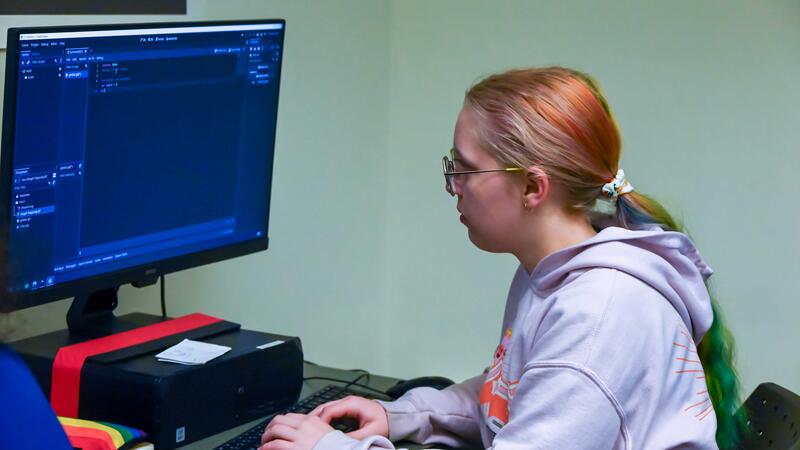 Game Development Camper working on her project