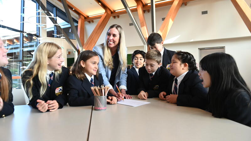 Becky Anderson with Grade 5 students in the atrium