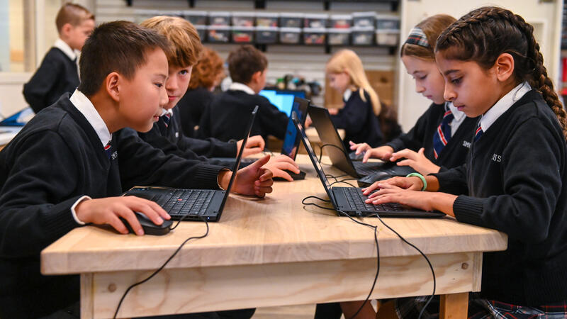 Junior School students on laptops in iLab