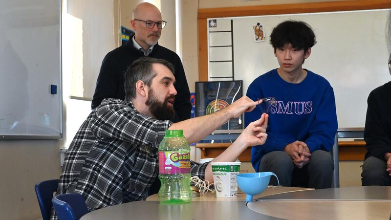 Dr. Trefor Bazett conducts a demonstration in math class.