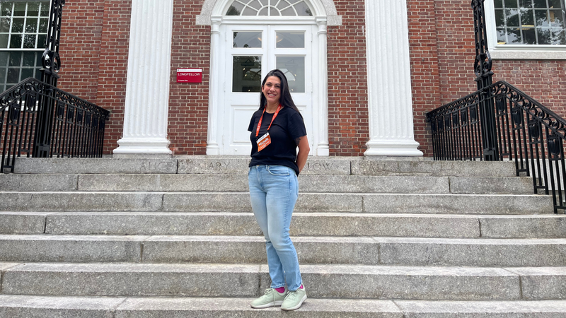 Grade 2 SMUS teacher Michelle Janke on steps at Harvard