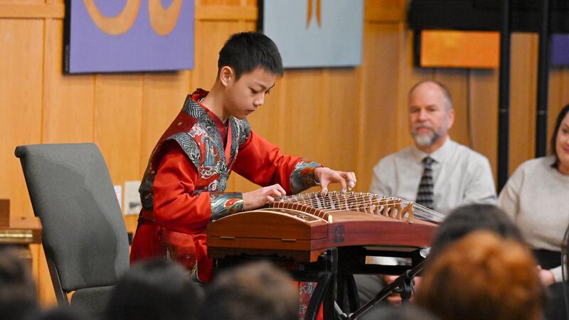 Grade 7 student Bruce Tian performs as part of Lunar New Year Celebrations