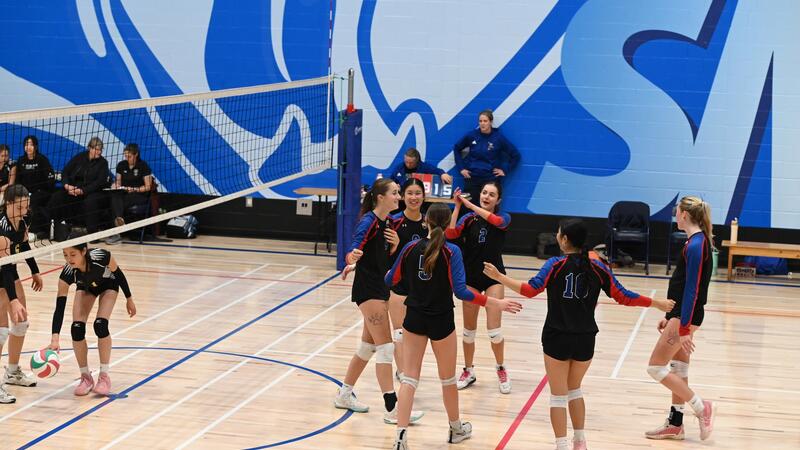 Senior Girls Volleyball celebrate on the court