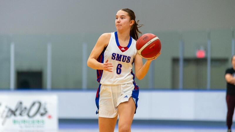 Avery Geddes playing basketball for SMUS