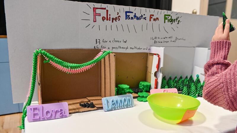 SMUS students in the Entrepreneur Club display their products at a marketplace