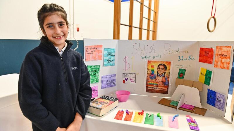 SMUS students in the Entrepreneur Club display their products at a marketplace