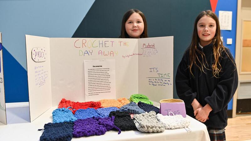 SMUS students in the Entrepreneur Club display their products at a marketplace