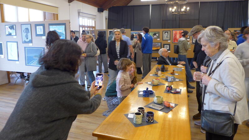 Visitors explore the SMUS Art Show in Brown Hall