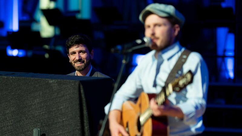 Alumni Zach Santella and Fintan O'Brien perform