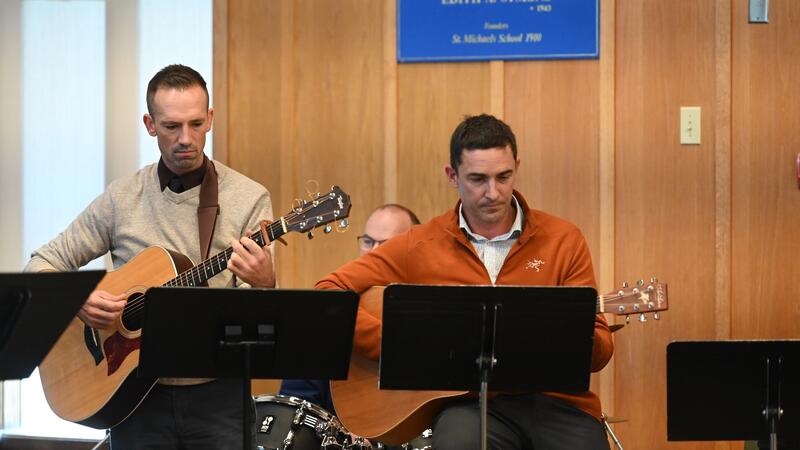 Eliot Anderson plays guitar with Reagan Daly in the Chapel