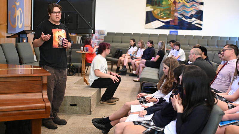 Jacob Beaton and his family speak to students in Chapel
