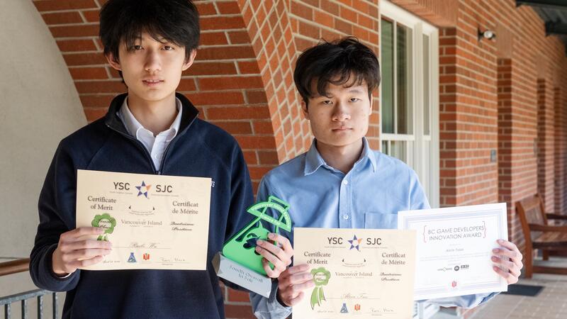 Science Fair participants Alvin Tsao and Ruibo Wu pose with their award certificates