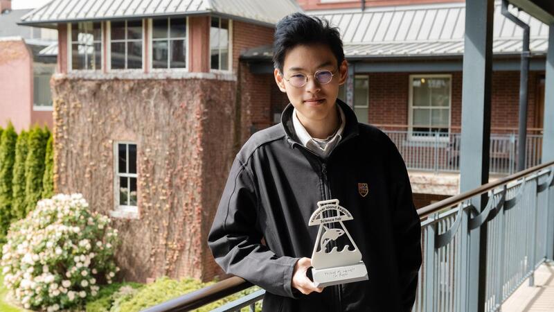 Senior School student George Wang poses with his Science Fair trophy