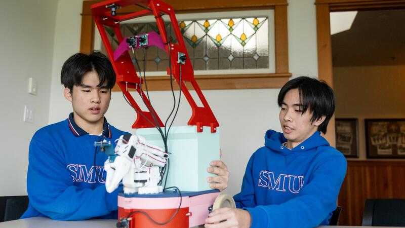 Sting Zhang and Edmond Aphiwetsa show off their Waste-E Science Fair Project