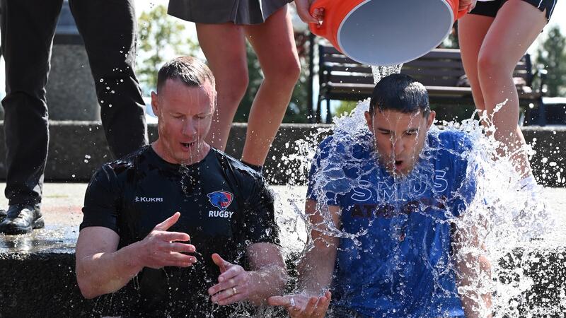 Eliot Anderson and Ritch Primrose get iced water dumped on them.