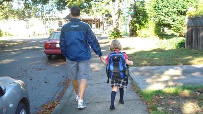 Eliot Anderson walking Makena in Kindergarten