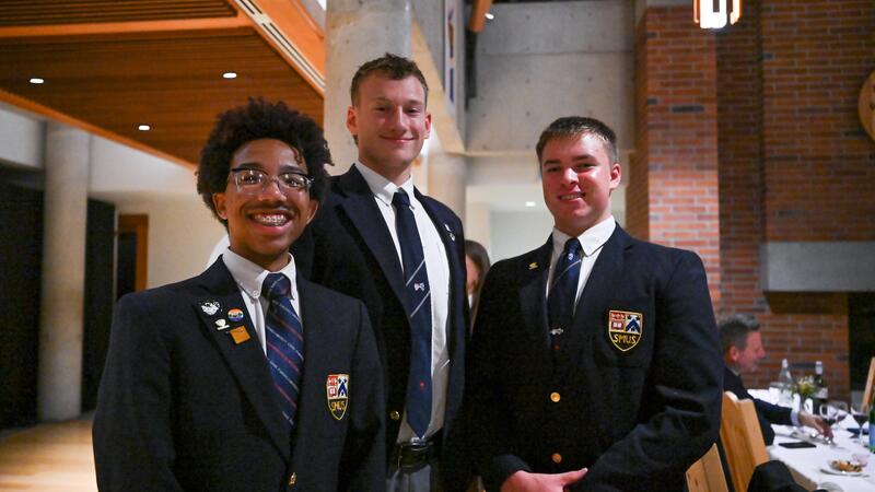 Three students pose for the camera 